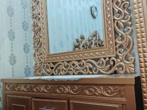 Golden luxury dressing table with cabin and drawers.